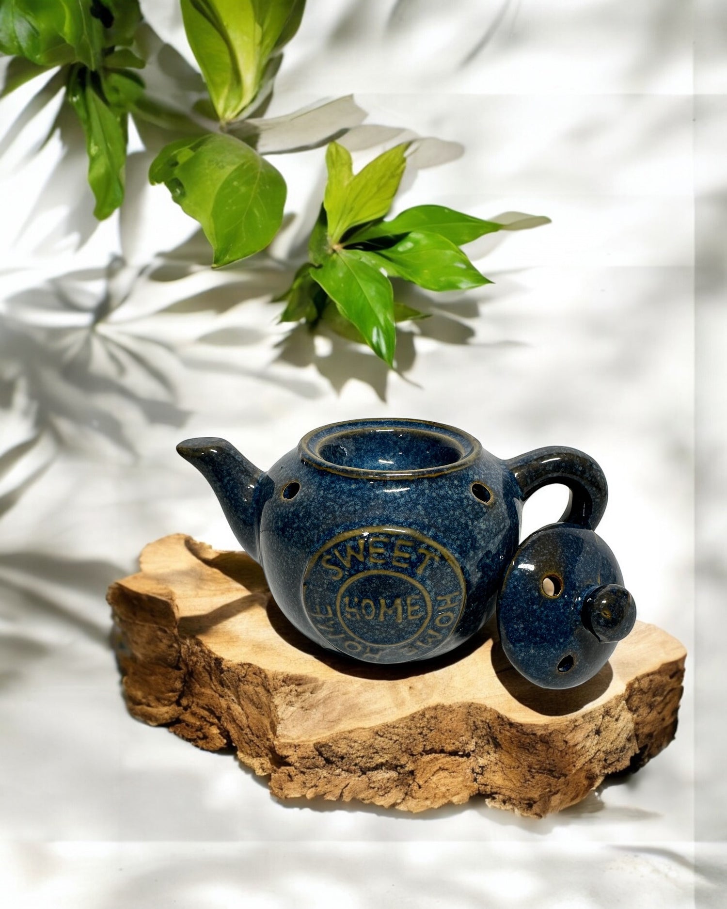 Blue ceramic tea pot wax melt burner with lid, perfect for home fragrance and stylish decor.