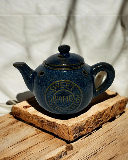 Blue ceramic tea pot wax melt burner with lid, perfect for home fragrance and stylish decor.