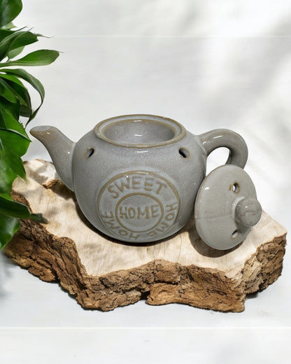 Grey ceramic tea pot wax melt burner with lid, perfect for home fragrance and stylish decor.