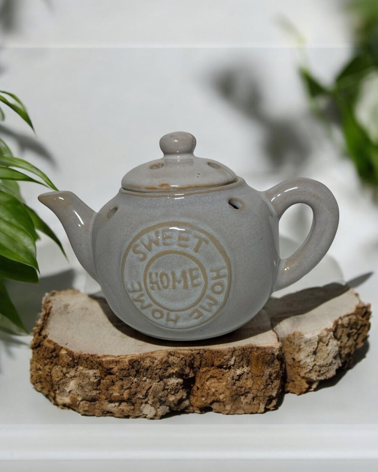 Grey ceramic tea pot wax melt burner with lid, perfect for home fragrance and stylish decor.