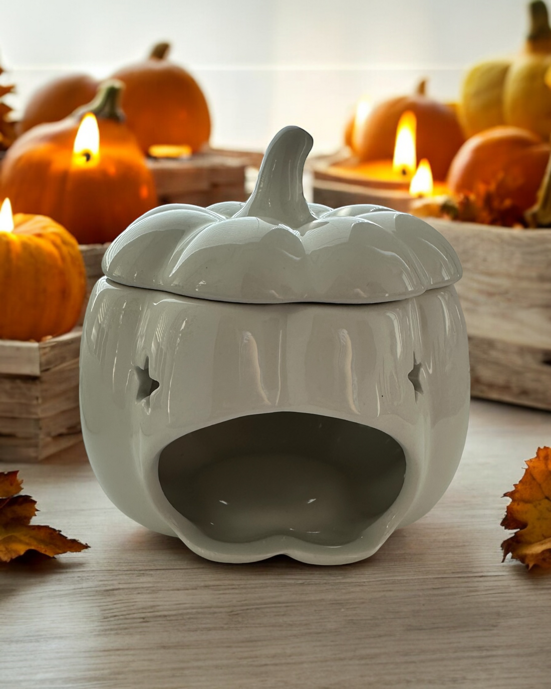 Pumpkin Wax Melt Burner with a charming pumpkin design for cosy autumn decor. Perfect for creating a festive Halloween atmosphere, it effortlessly fills your home with delightful fragrances. Ideal for gifting and compatible with all wax melts, this burner enhances any seasonal décor.
