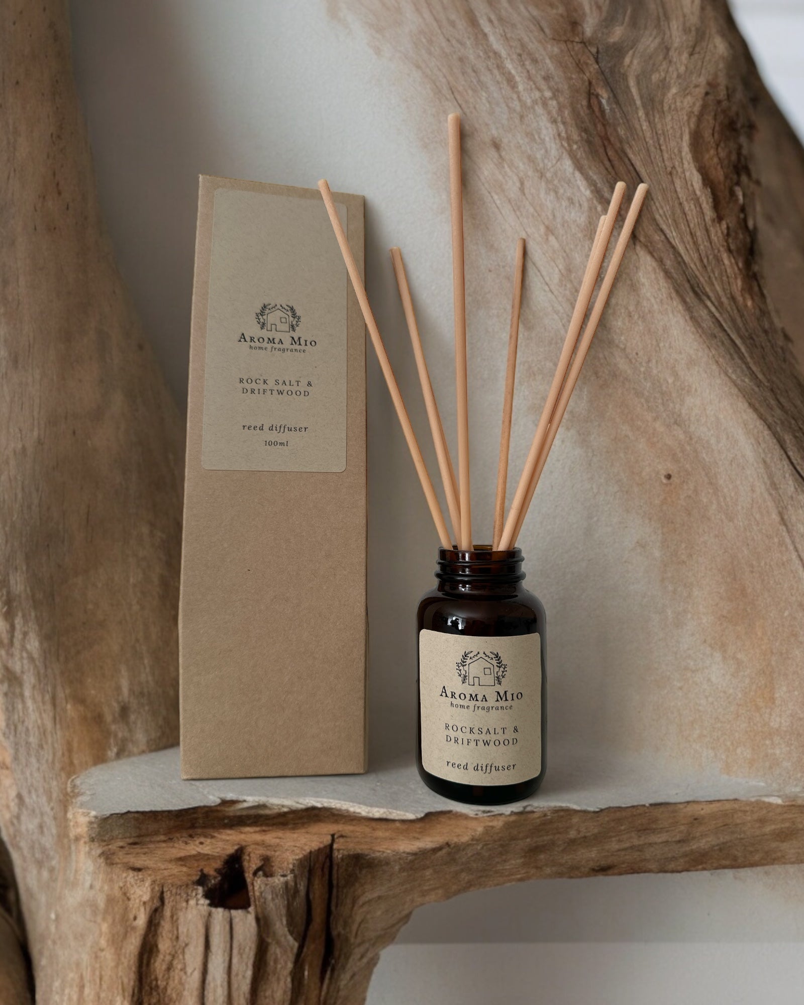 Rocksalt &amp; Driftwood Reed Diffuser, featuring a refreshing blend of coastal scents. Combines rocksalt and driftwood notes to enhance your home with a clean, oceanic fragrance, perfect for creating a serene and inviting atmosphere.