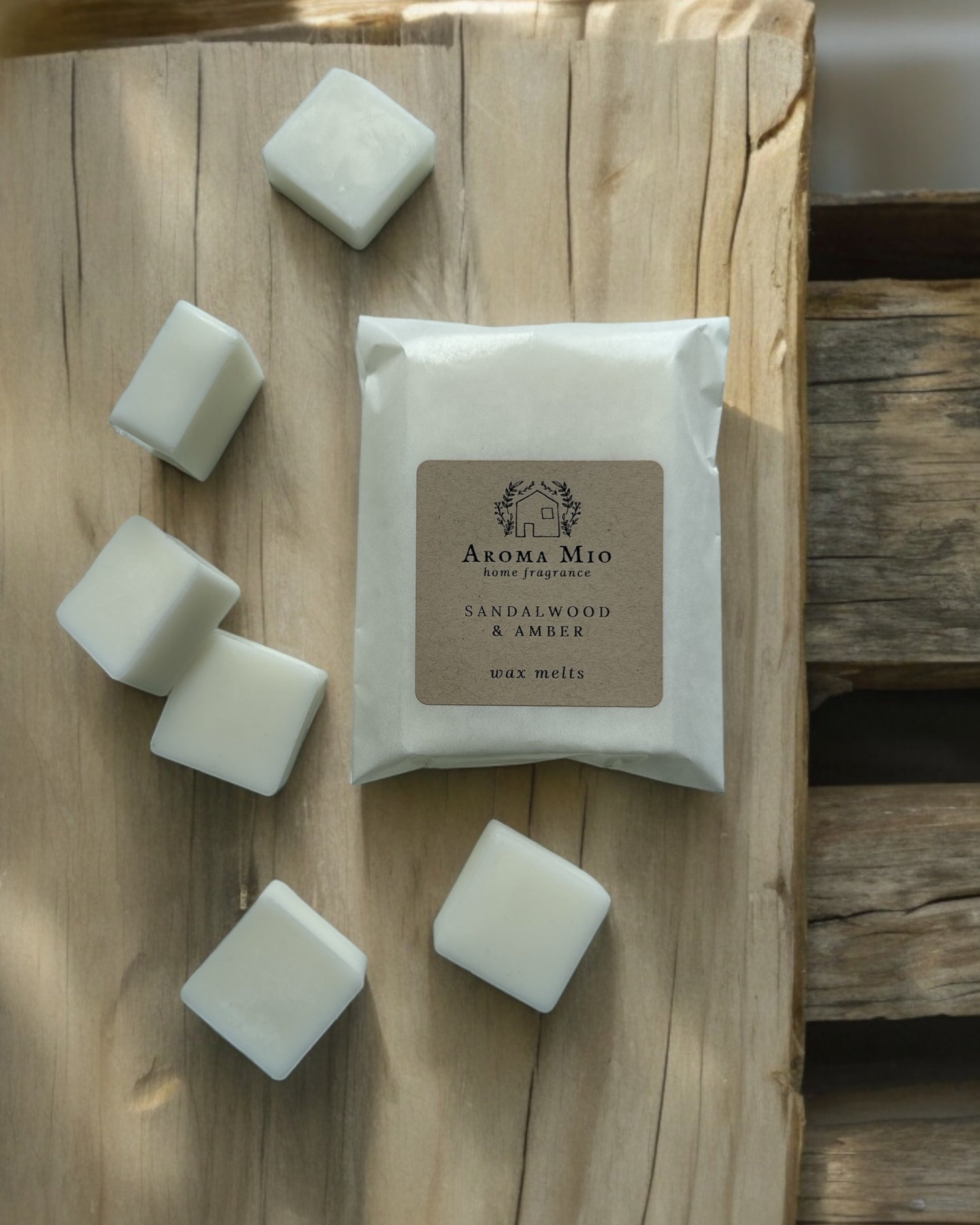 Sandalwood &amp; Amber Wax Melts, featuring a rich, warm blend of soothing sandalwood and luxurious amber. Perfect for creating a cozy, inviting atmosphere in your home with a sophisticated, long-lasting fragrance that adds elegance to any room.