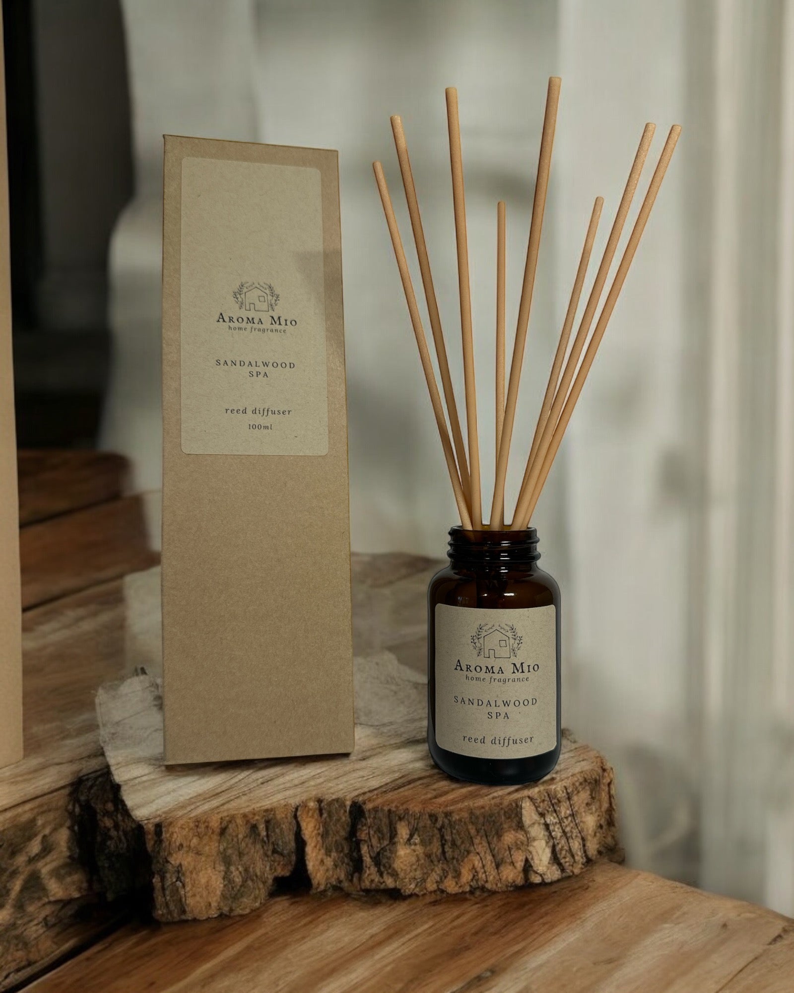 Sandalwood Spa Reed Diffuser, offering a relaxing blend of bergamot, oud, and sandalwood. A perfect flameless home fragrance alternative to wax melts, creating a long-lasting, spa-like atmosphere in any room. Ideal for both men and women seeking tranquility and elegance.